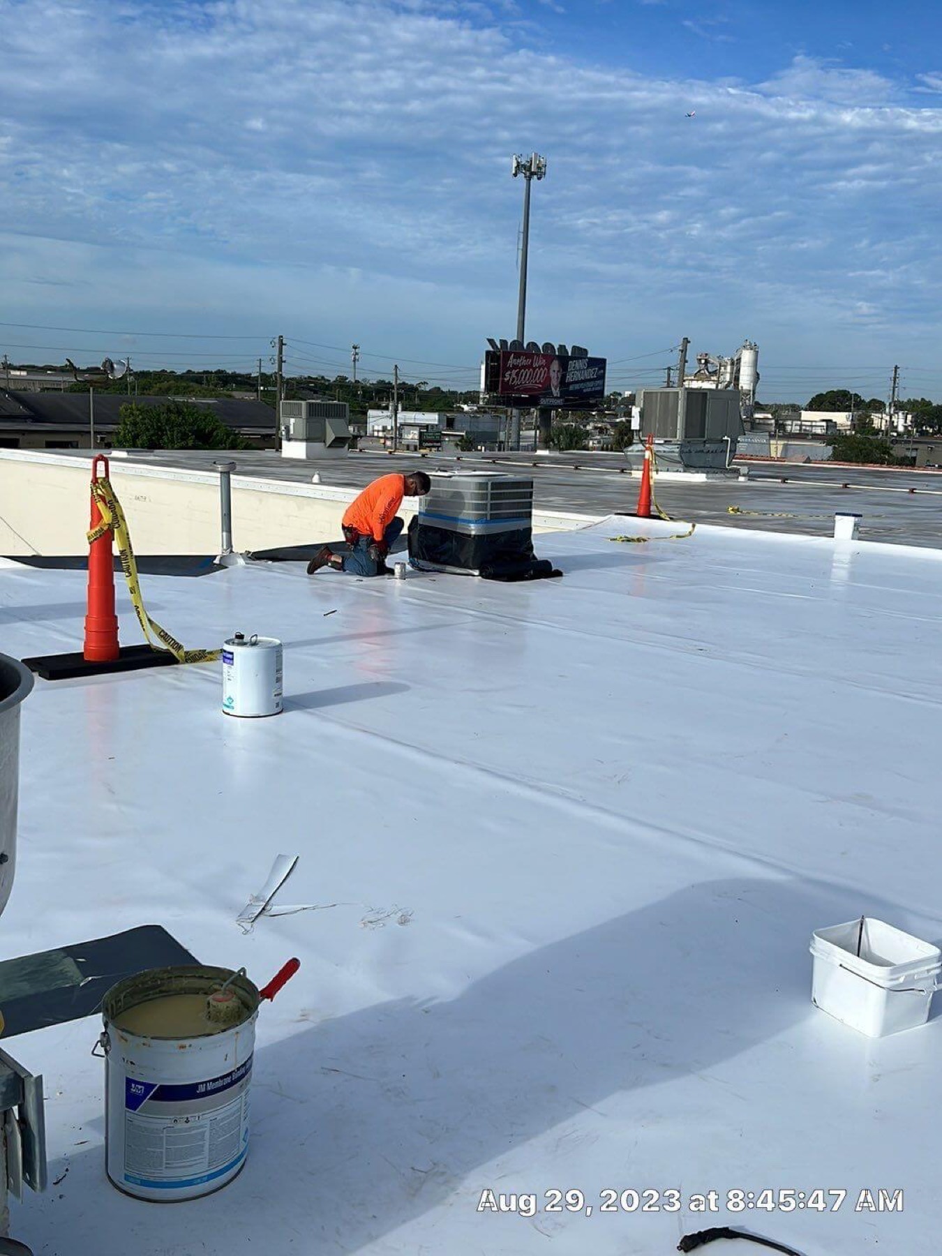 Total Roof Services crew working on a commercial roof installation in Central Florida